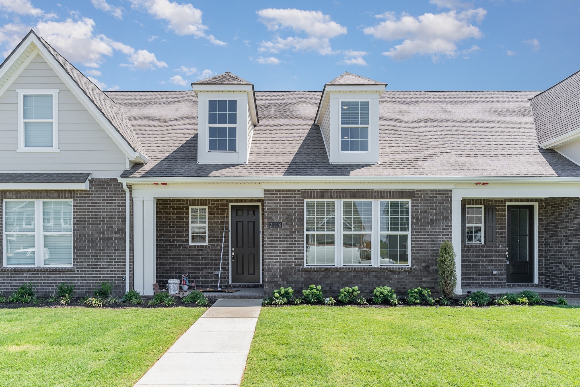 1079 Wrights Mill Road, Unit H8 Spring Hill, TN 37174 - Photo 55 of 64 a front view of a house with a yard