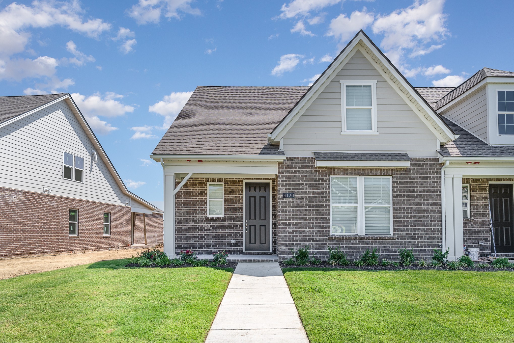 1079 Wrights Mill Road, Unit H8 Spring Hill, TN 37174 - Photo 56 of 64 a front view of a house with a yard