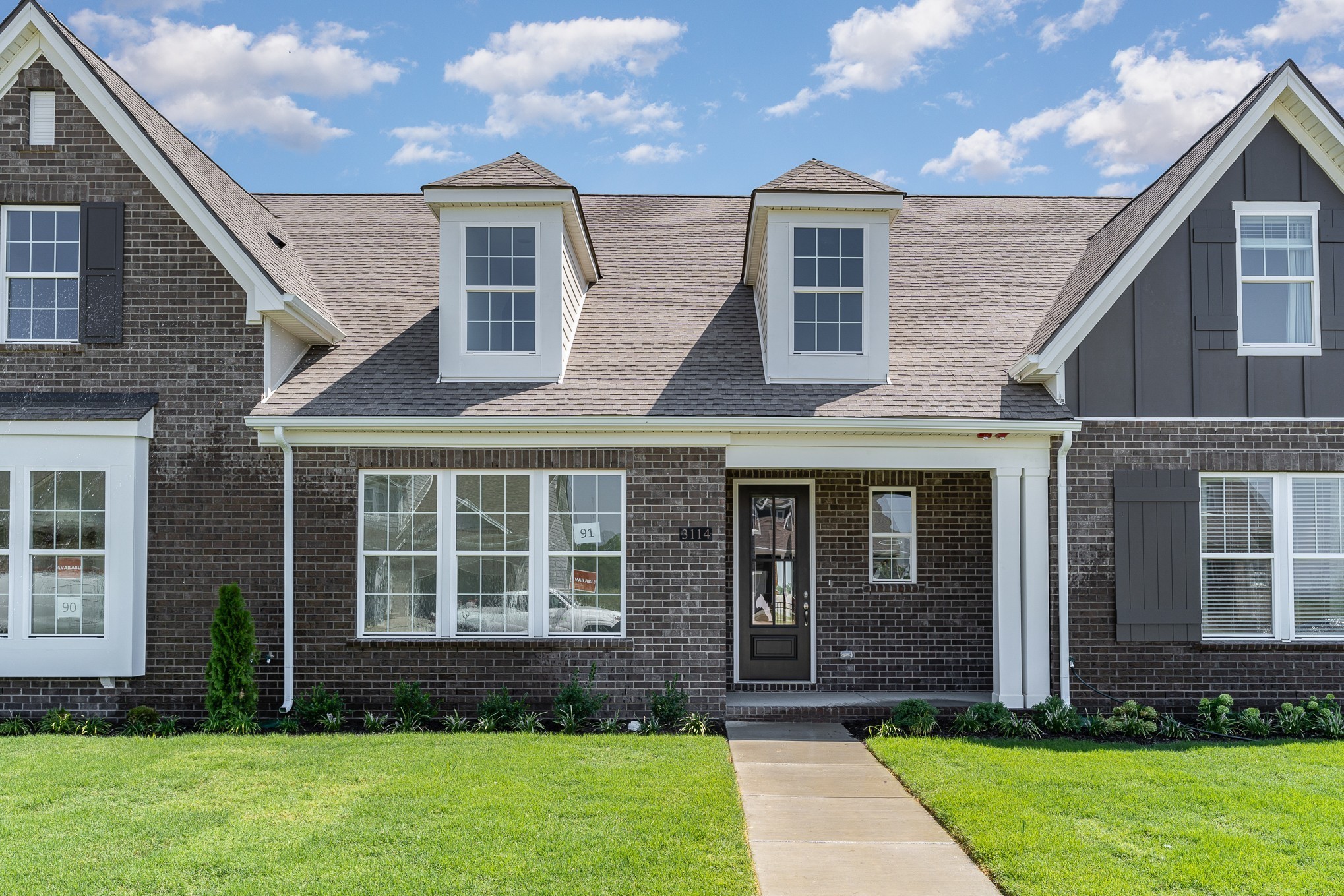 1079 Wrights Mill Road, Unit H8 Spring Hill, TN 37174 - Photo 57 of 64 a front view of a house with a yard
