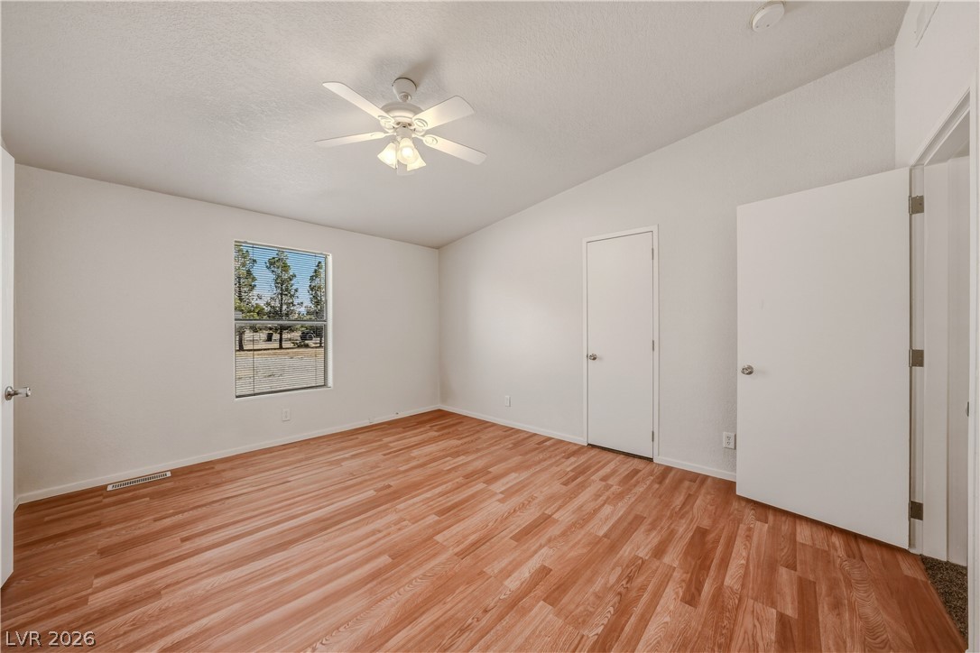 1890 West Dyer Road Pahrump, NV 89048 - Photo 38 of 40 This spacious room features ample natural light and durable flooring, perfect for versatile living.