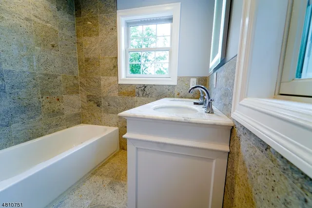 a bathroom with a sink and a bathtub