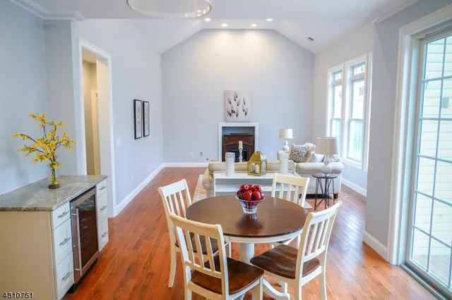 a view of a dining room with furniture and a window
