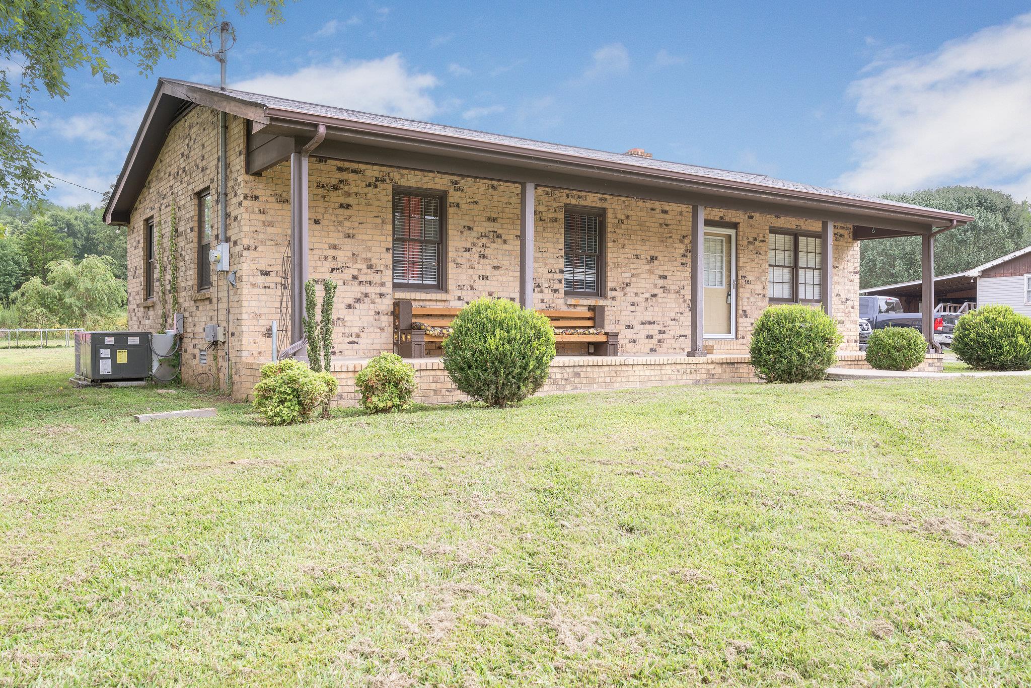 1011 Hamilton Chambers Road Lebanon, TN 37087 - Photo 1 of 14 a front view of a house with garden