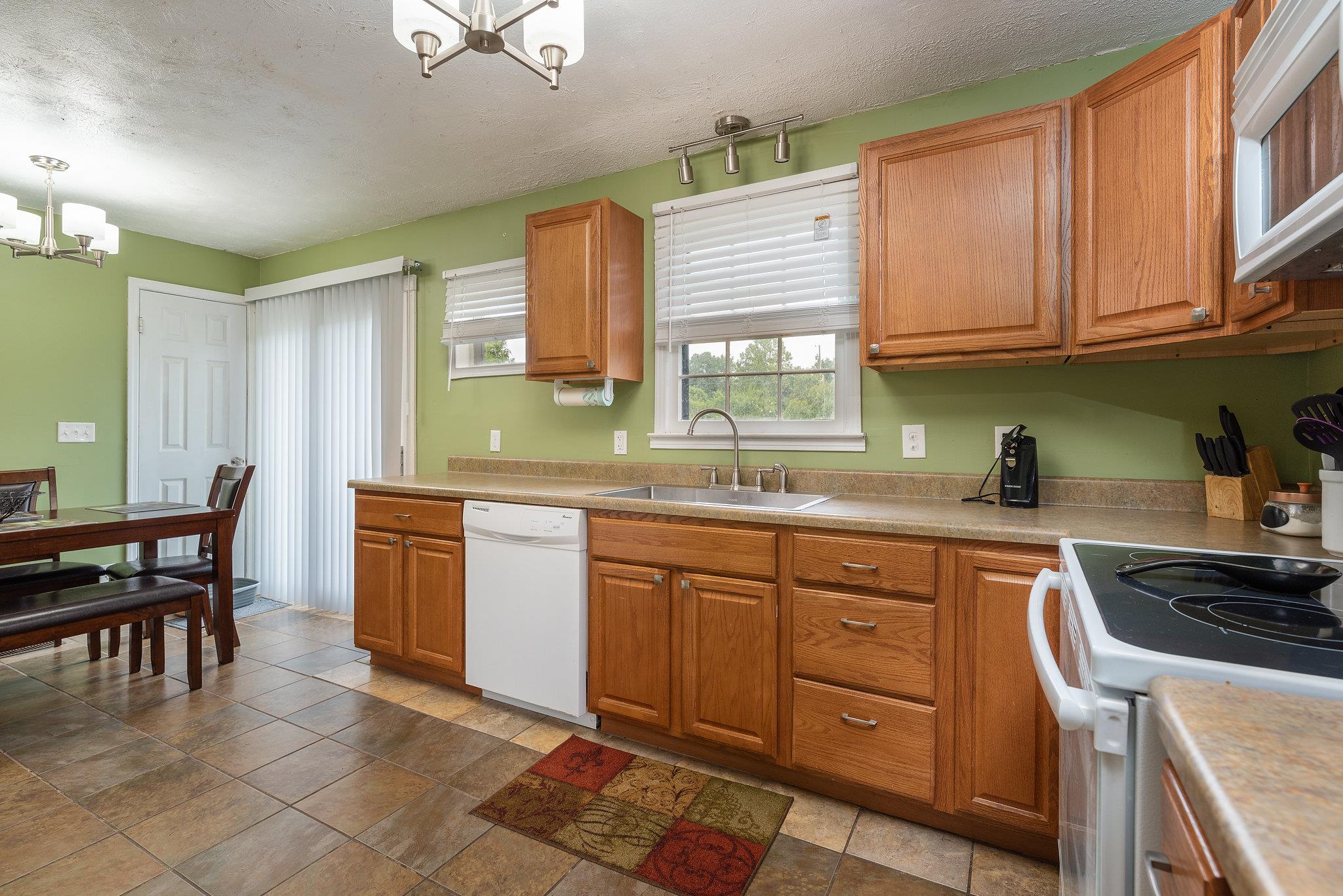 1011 Hamilton Chambers Road Lebanon, TN 37087 - Photo 5 of 14 a kitchen with stainless steel appliances granite countertop a sink and cabinets