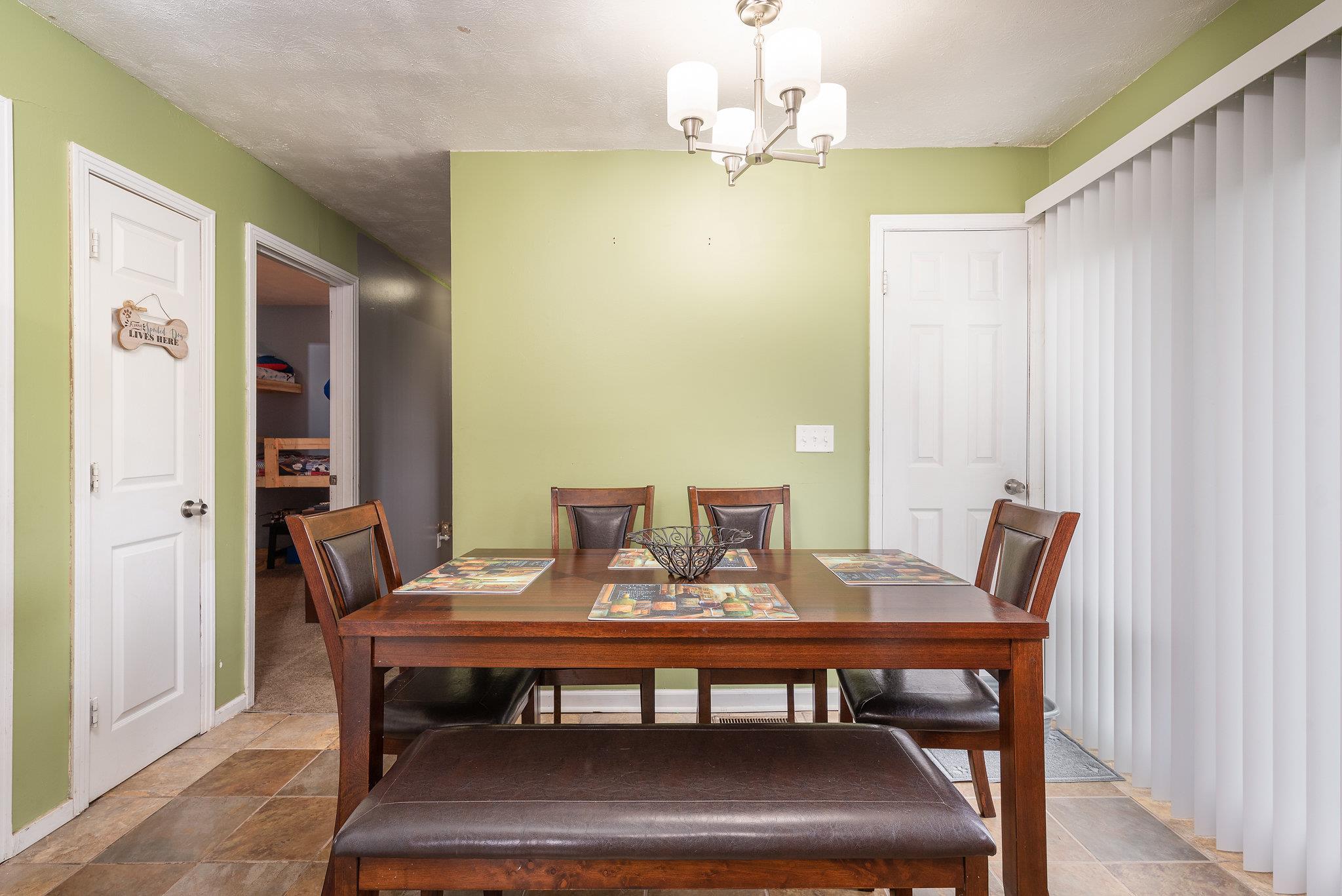 1011 Hamilton Chambers Road Lebanon, TN 37087 - Photo 6 of 14 a view of a dining room with furniture window and wooden floor