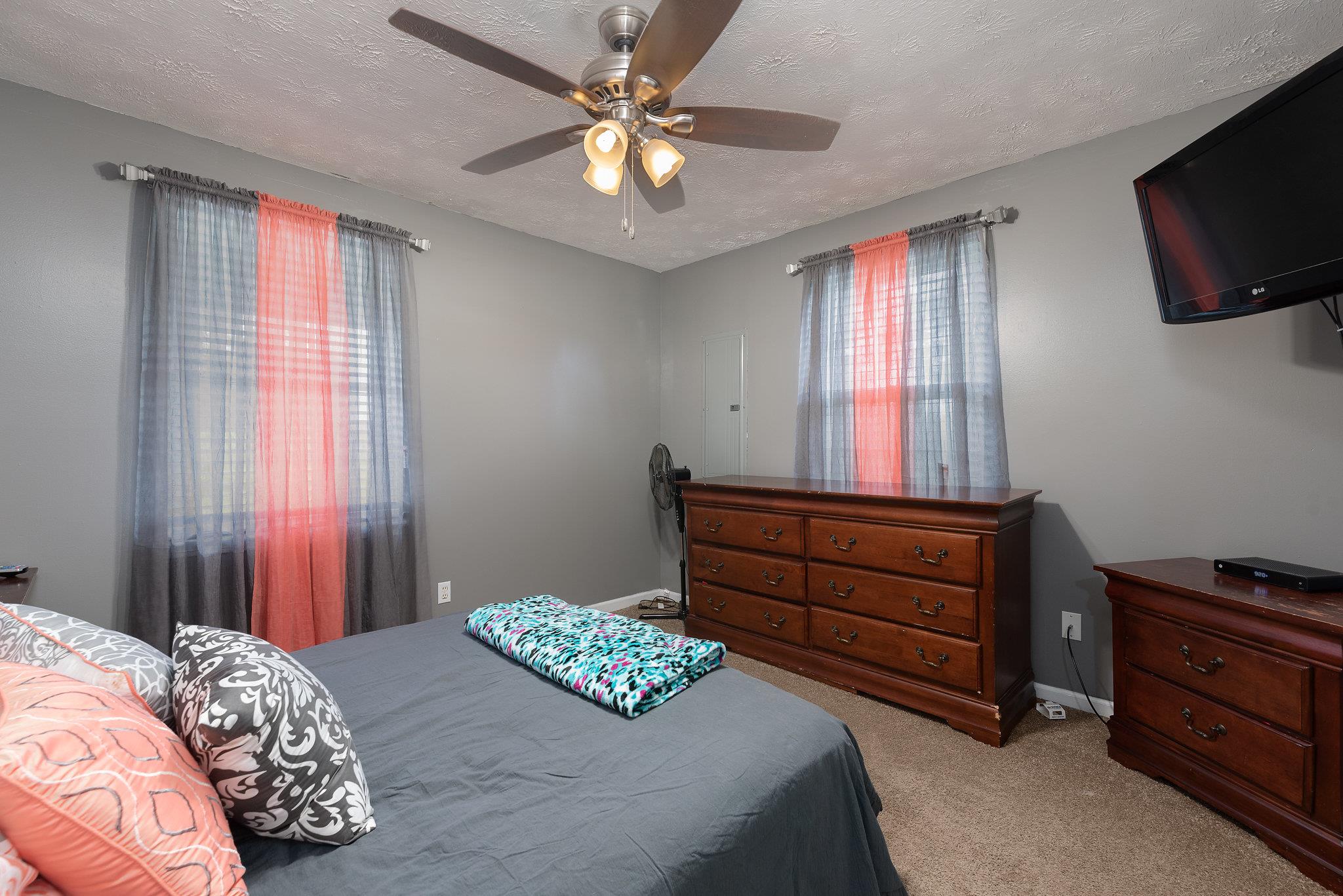 1011 Hamilton Chambers Road Lebanon, TN 37087 - Photo 7 of 14 a bedroom with a bed and a television