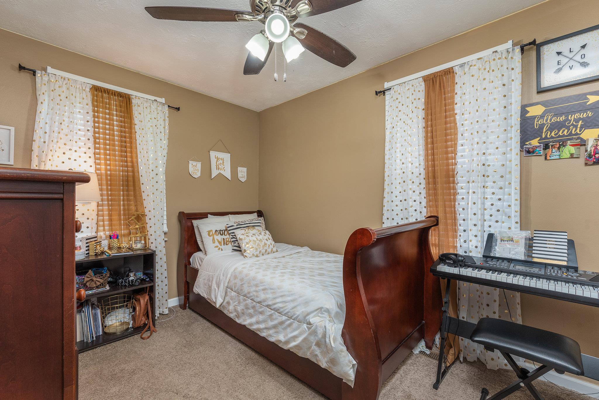 1011 Hamilton Chambers Road Lebanon, TN 37087 - Photo 9 of 14 a bedroom with a bed and windows