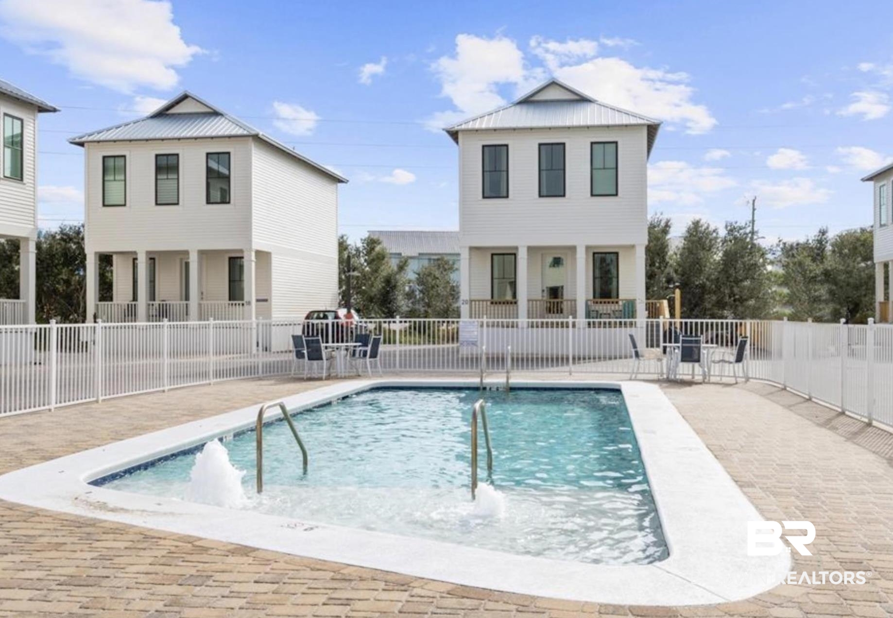 20 West Gate Orange Beach, AL 36561 - Photo 2 of 15 Community pool with a patio area
