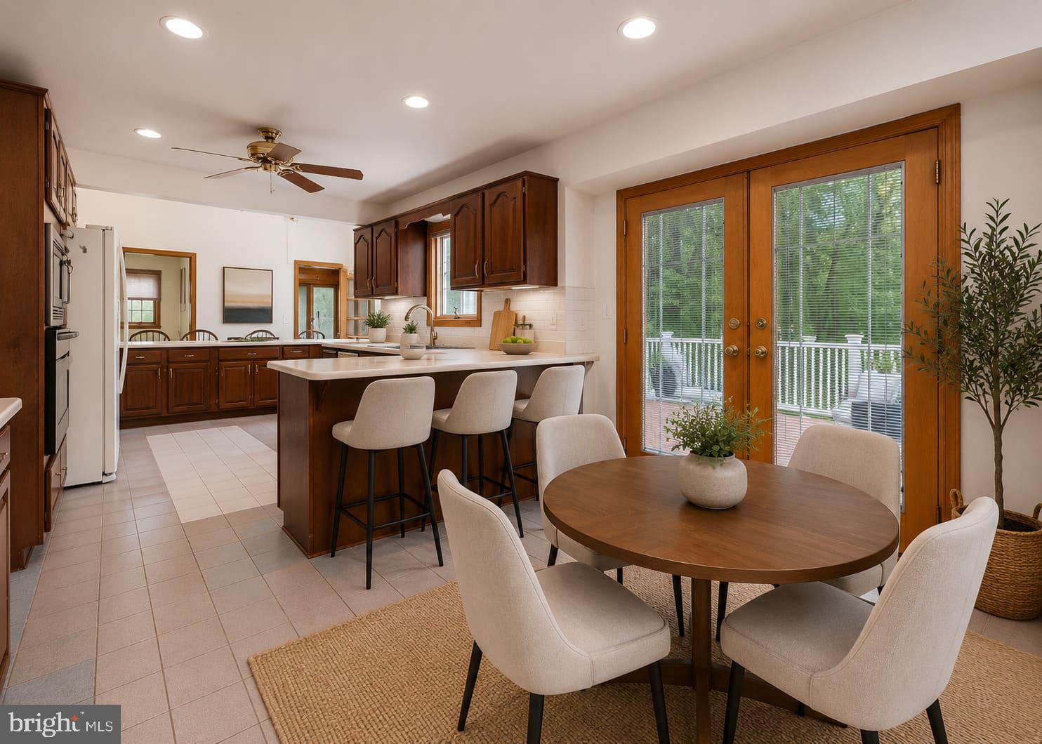 4945 West Running Brook Road Columbia, MD 21044 - Photo 16 of 65 Kitchen to outdoor living Virtually staged
