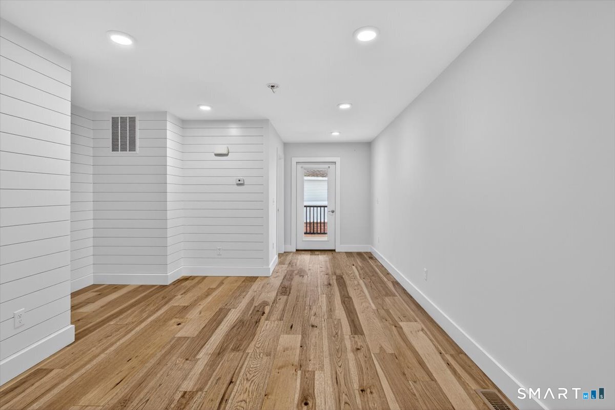 32 1/2 Village Road, Unit 1 Milford, CT 06460 - Photo 14 of 31 a view of wooden floor in an empty room