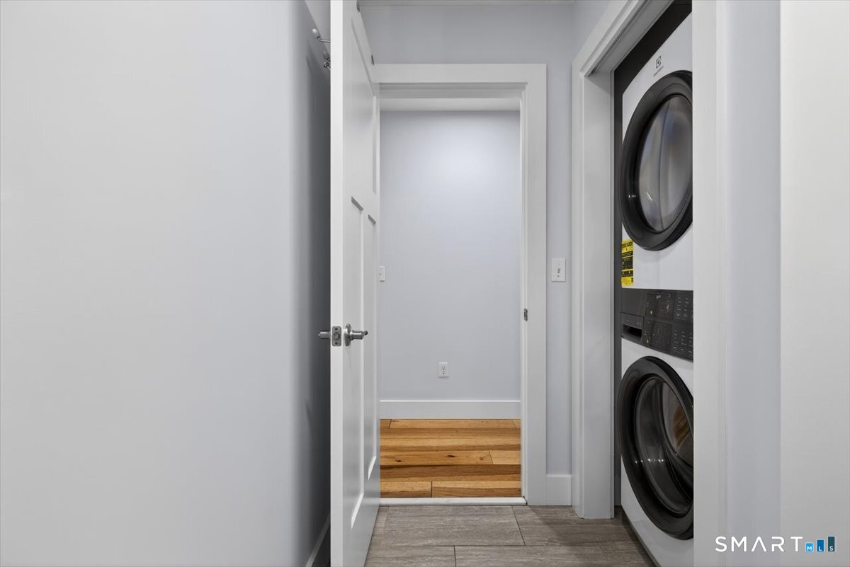 32 1/2 Village Road, Unit 1 Milford, CT 06460 - Photo 17 of 31 a utility room with mirror dryer and washer