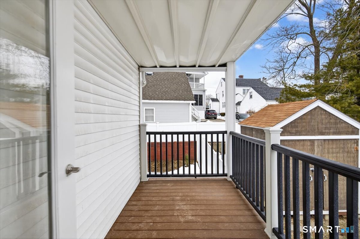 32 1/2 Village Road, Unit 1 Milford, CT 06460 - Photo 23 of 31 a view of a backyard with wooden fence