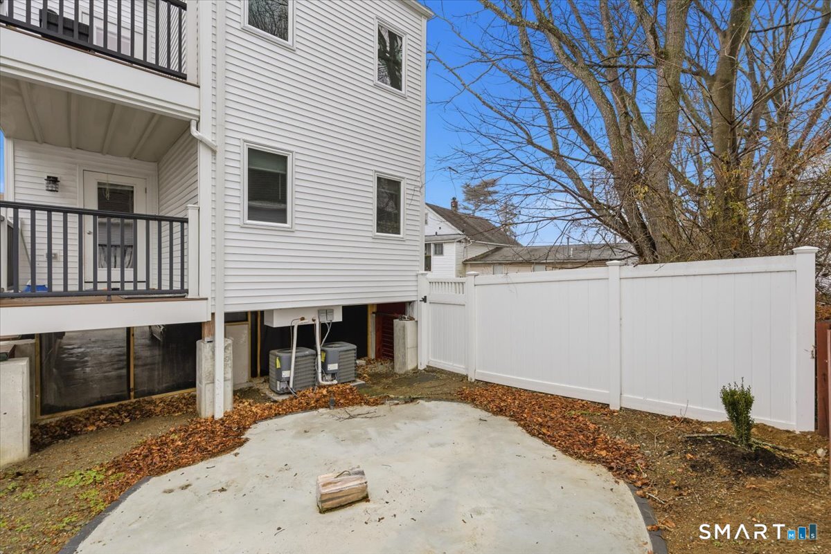 32 1/2 Village Road, Unit 1 Milford, CT 06460 - Photo 26 of 31 a backyard of a house