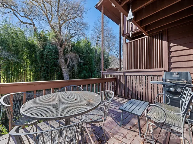 a view of a balcony with furniture