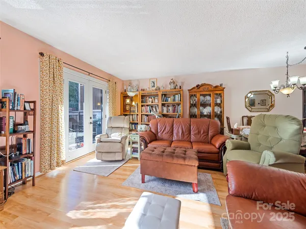 a living room with furniture and a lamp