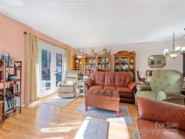 a living room with furniture and a lamp