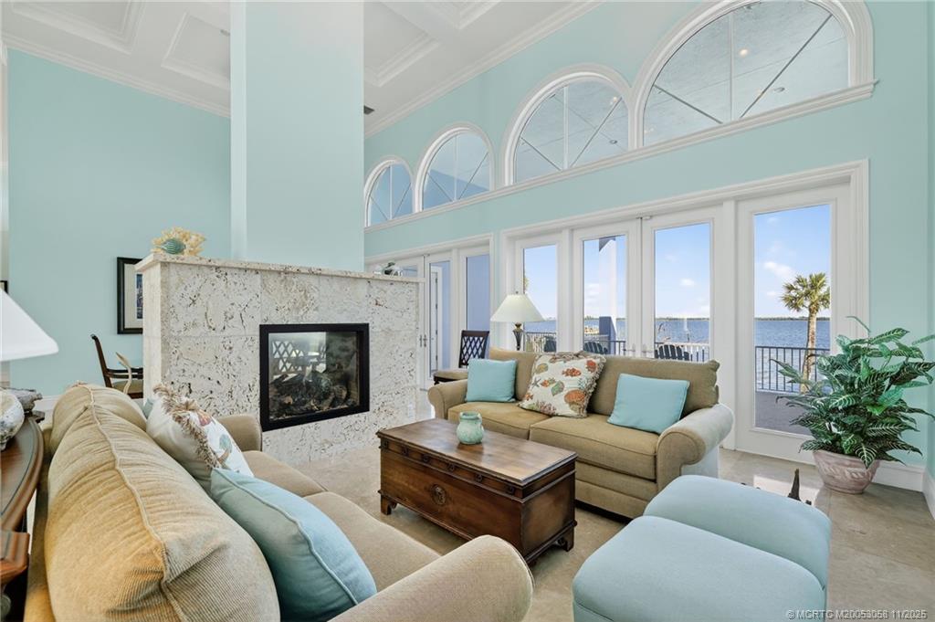 70 North Sewalls Point Road Stuart, FL 34996 - Photo 14 of 72 a living room with furniture and a fireplace