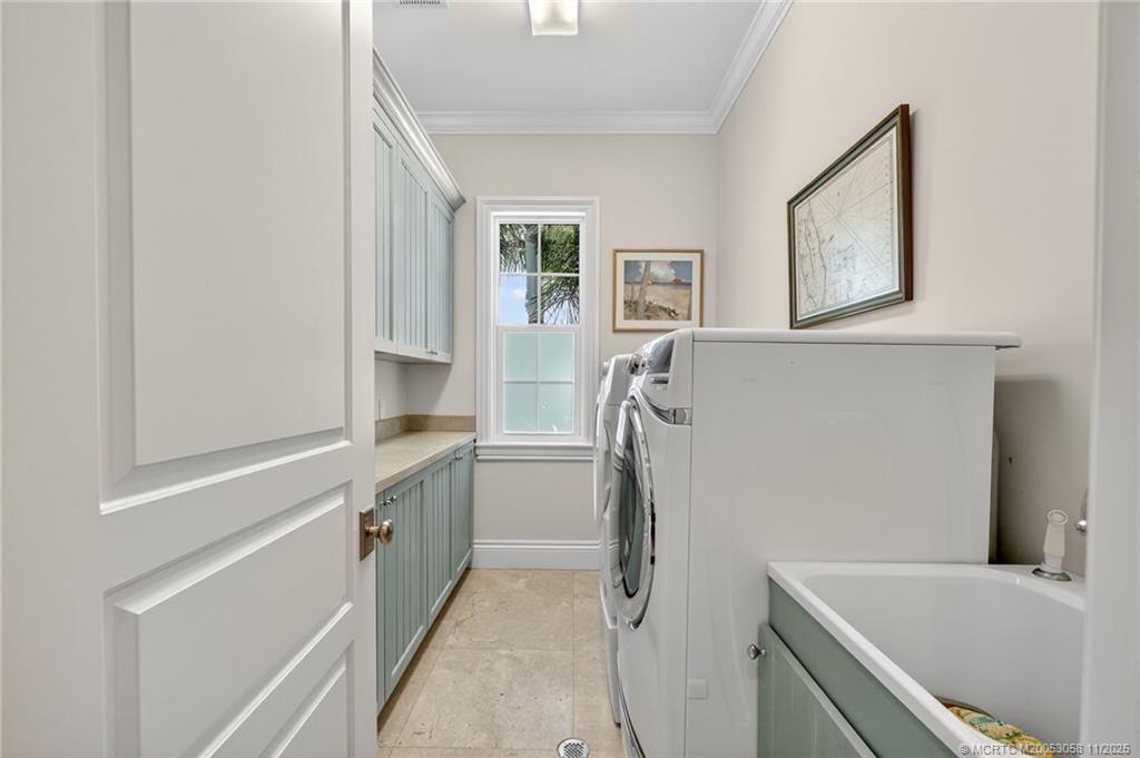 70 North Sewalls Point Road Stuart, FL 34996 - Photo 54 of 72 a kitchen with a refrigerator and a sink