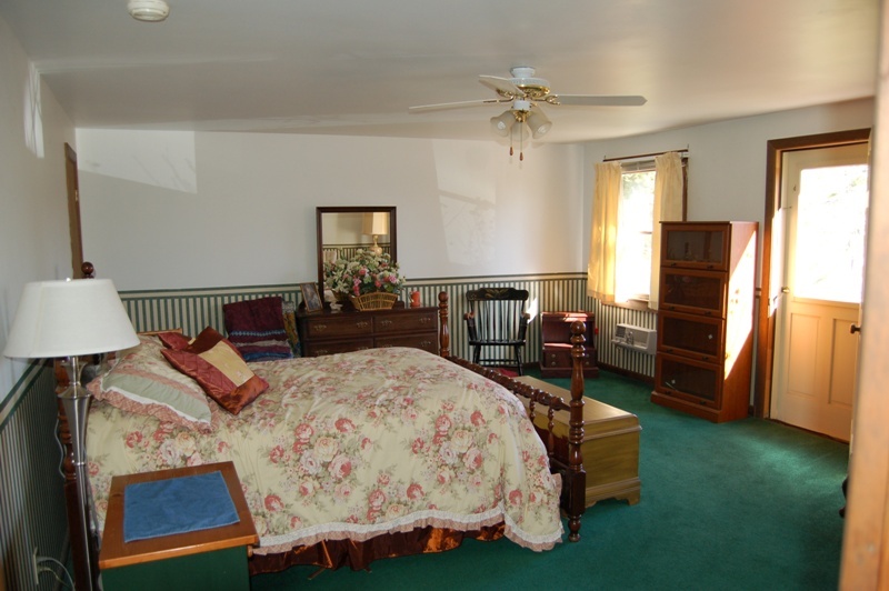 223 Main Road Monterey, MA 01245 - Photo 8 of 10 a bed room with a bed furniture and a window