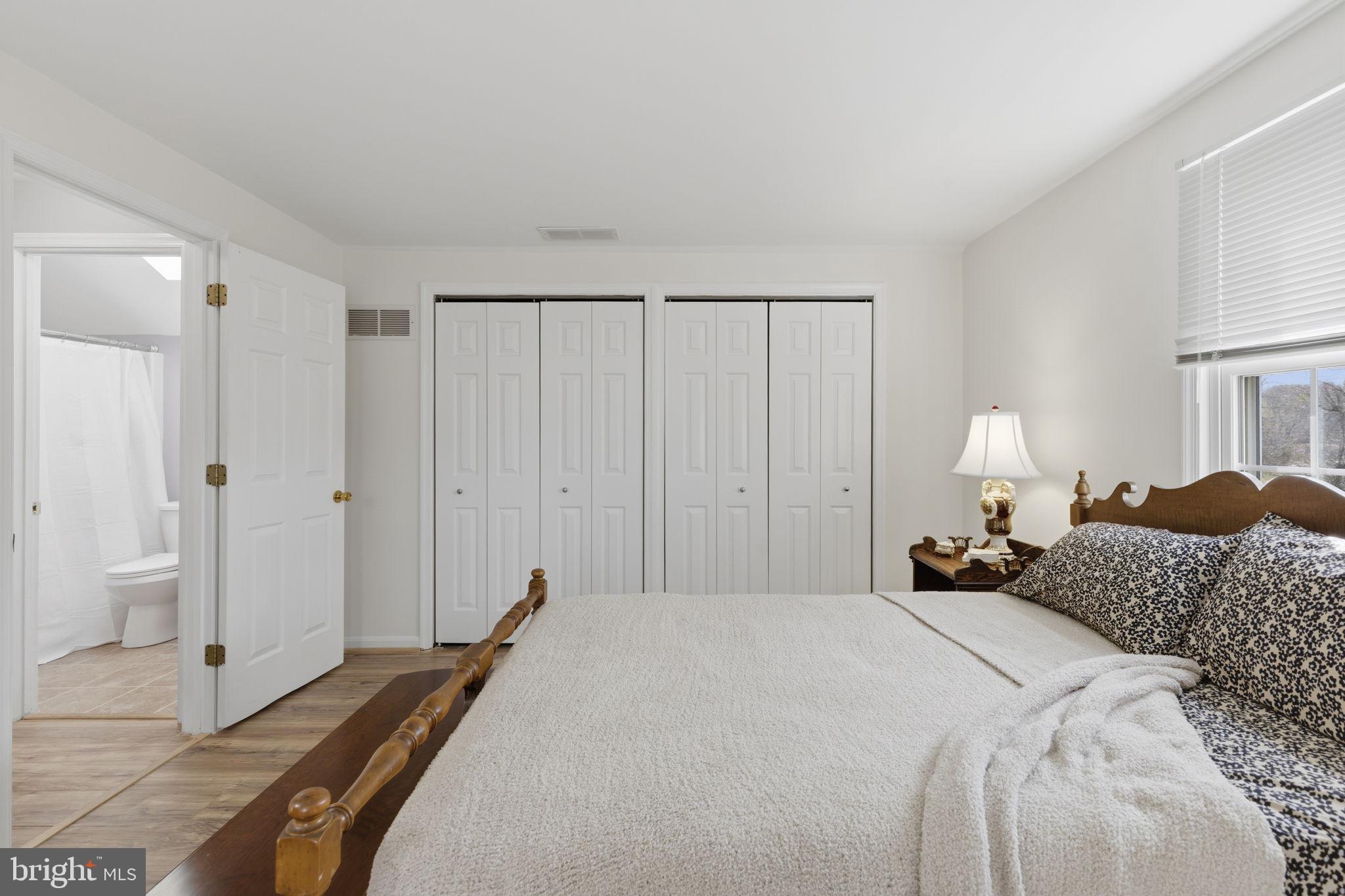 3831 Wilkinson Road Havre de Grace, MD 21078 - Photo 21 of 51 a bedroom with a bed and a lamp