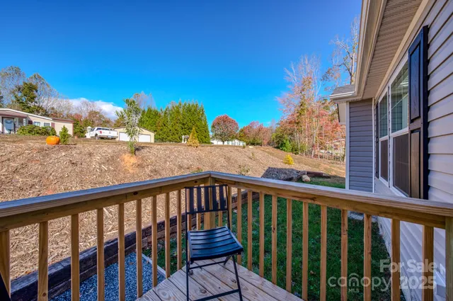 a view of a balcony with wooden fence