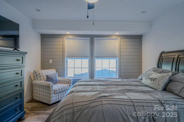 a bedroom with a bed and couch