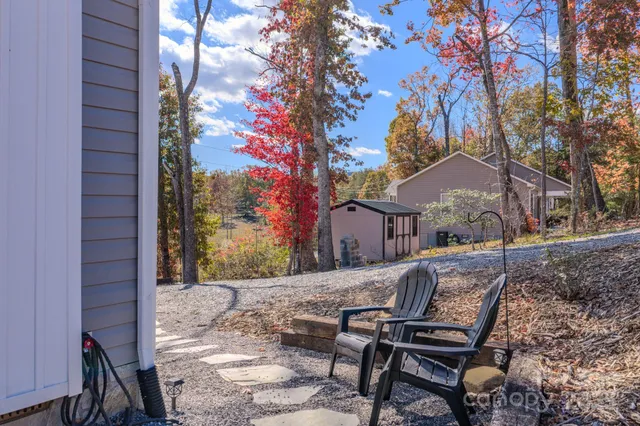 a view of a bench in the backyard