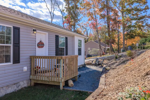a view of a porch with a table and chairs