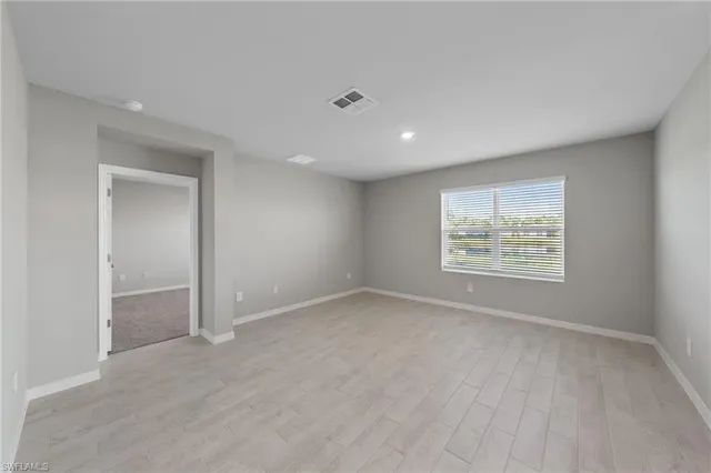 an empty room with windows