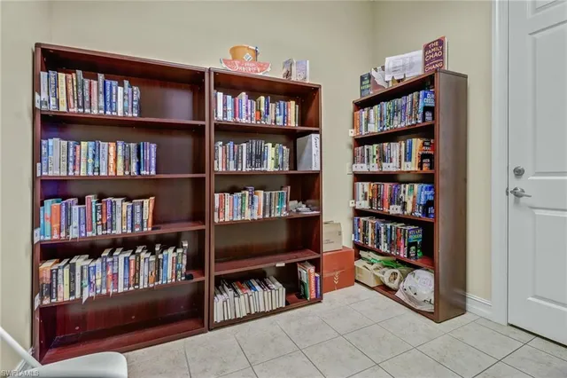 a view of a dining area with furniture and a large window