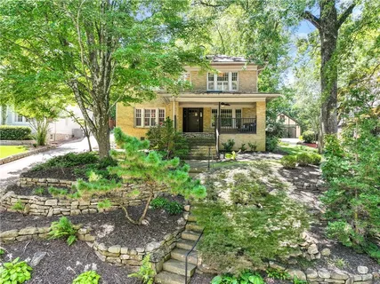 a front view of a house with garden