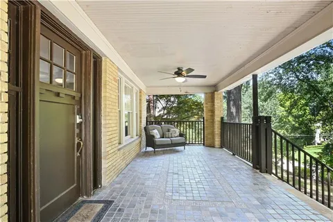 a view of a porch with wooden floor and outdoor space