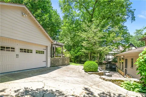 a view of balcony with furniture and garden