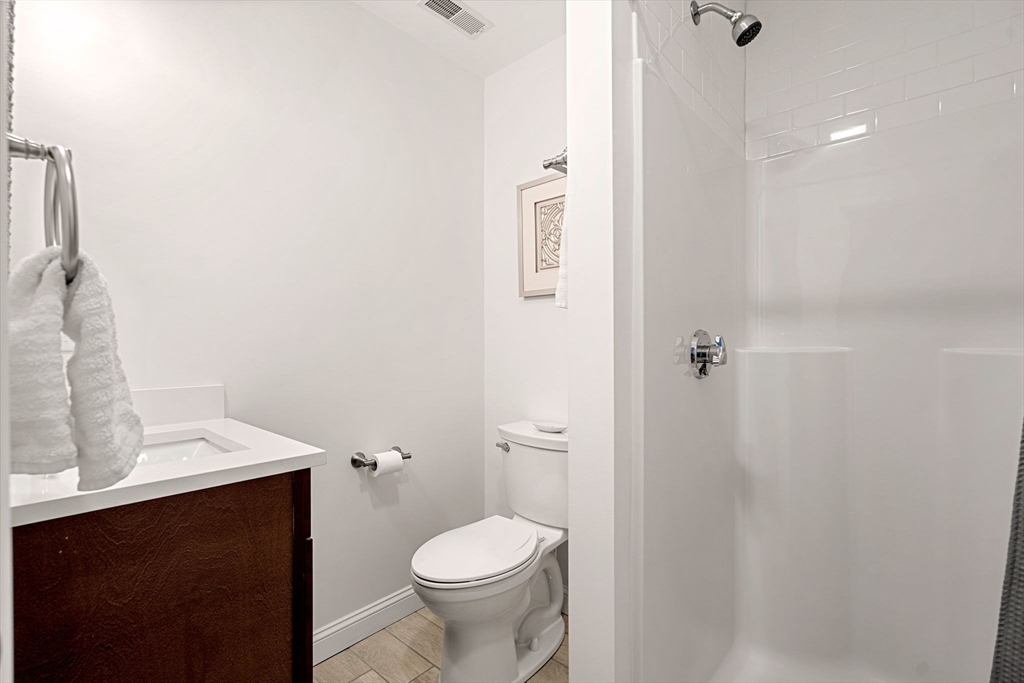 45 Old County Road, Unit 1 Salisbury, MA 01952 - Photo 17 of 40 a bathroom with a sink and a toilet