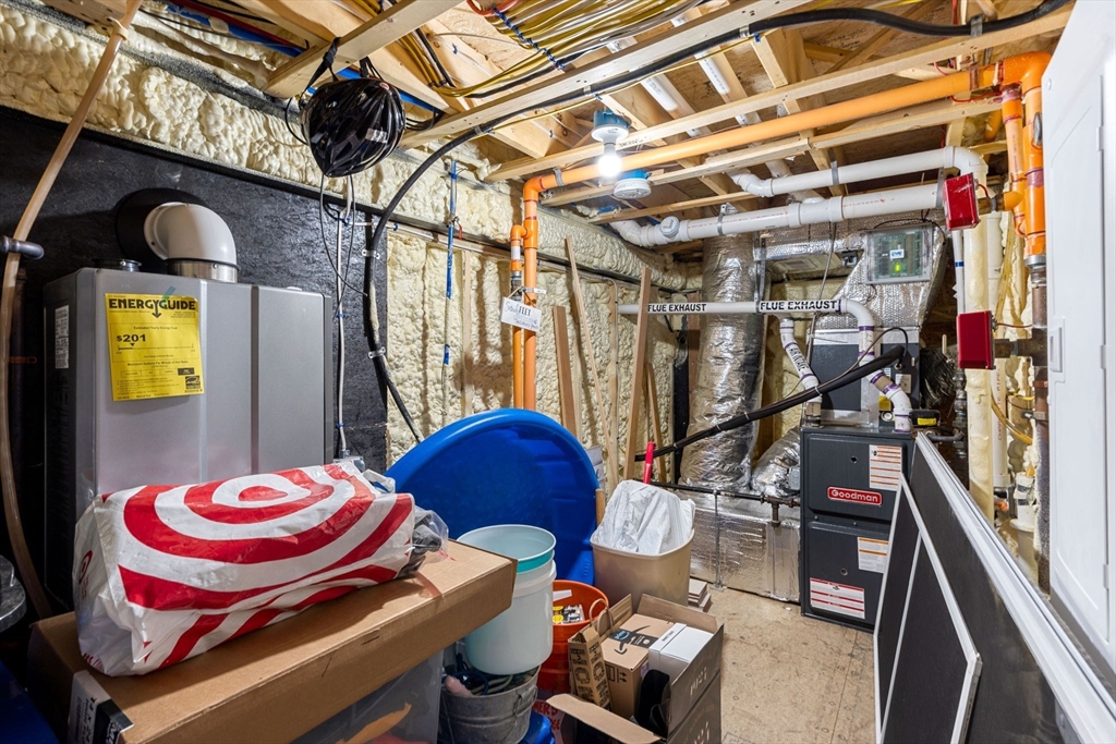 45 Old County Road, Unit 1 Salisbury, MA 01952 - Photo 24 of 40 a water heater room with a couch