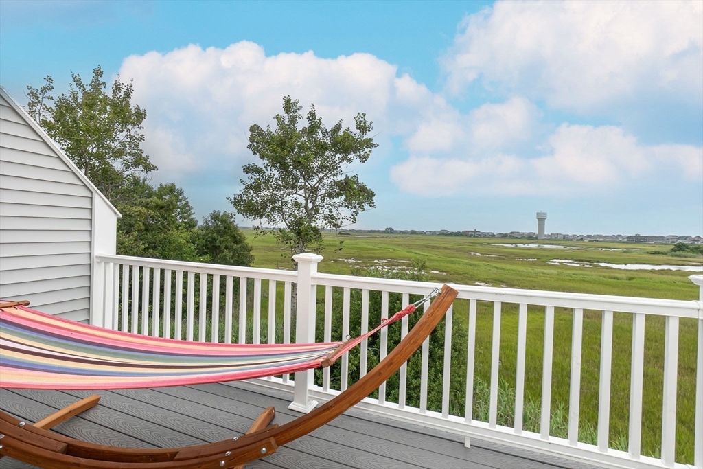 45 Old County Road, Unit 1 Salisbury, MA 01952 - Photo 4 of 40 a view of a balcony with wooden floor