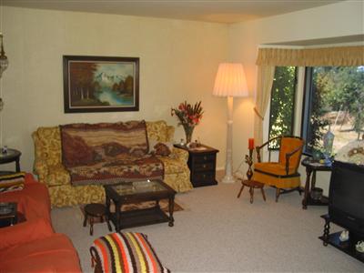 232 Pleasant Hill Road Sebastopol, CA 95472 - Photo 4 of 7 a bedroom with furniture and a lamp