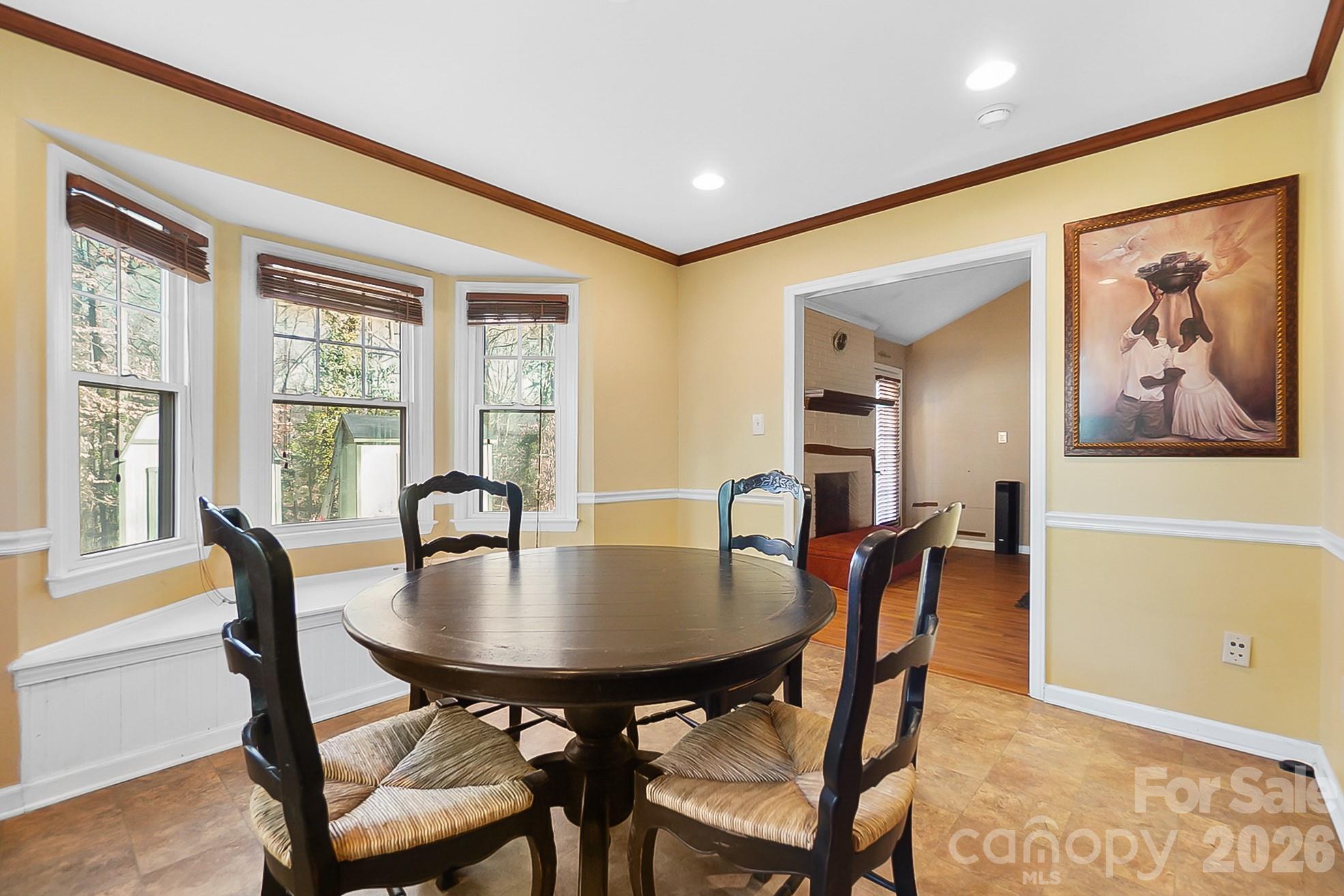 6906 Streamside Drive Charlotte, NC 28212 - Photo 12 of 48 a view of a dining room with furniture window and outside view