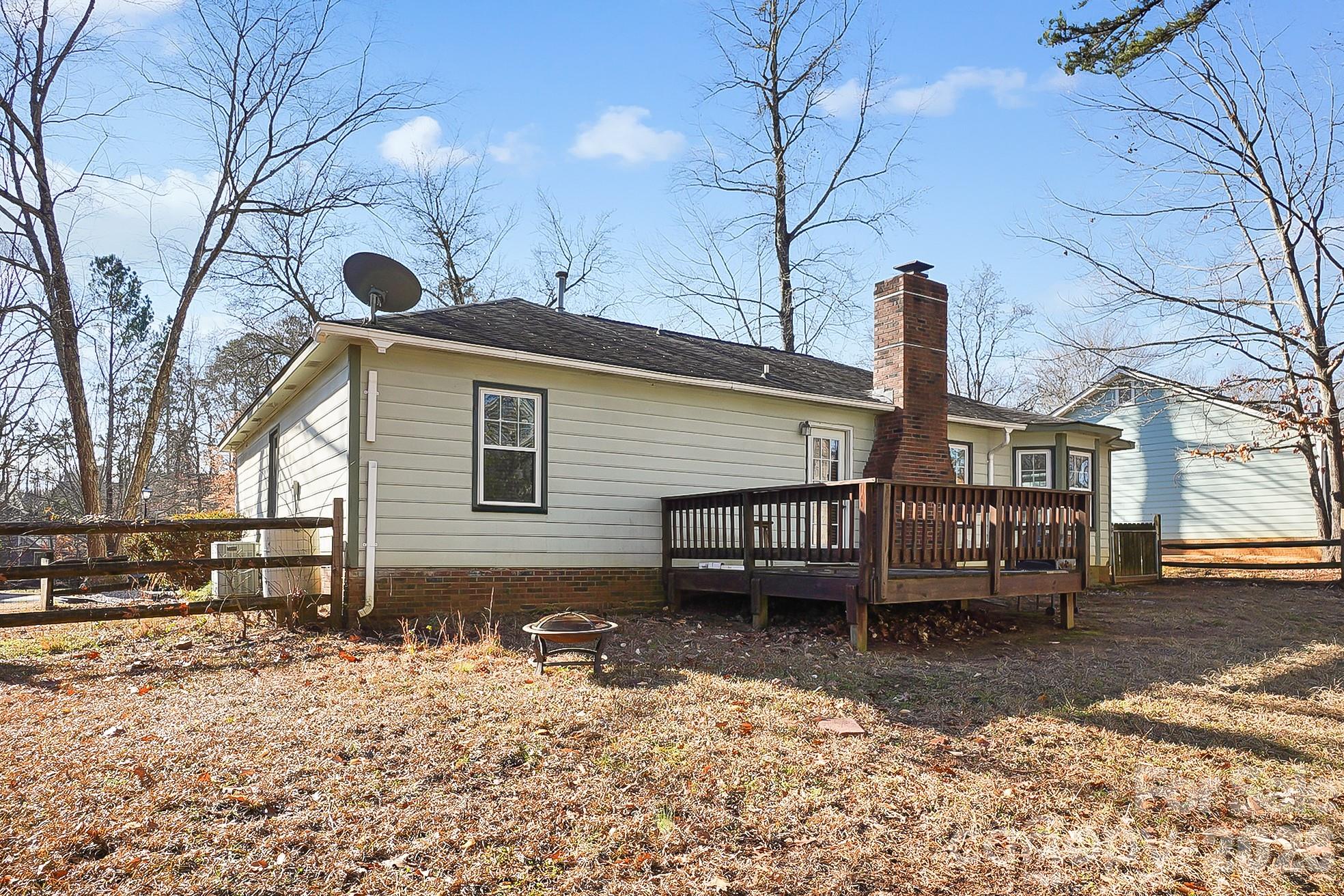 6906 Streamside Drive Charlotte, NC 28212 - Photo 32 of 48 a front view of a house with garden