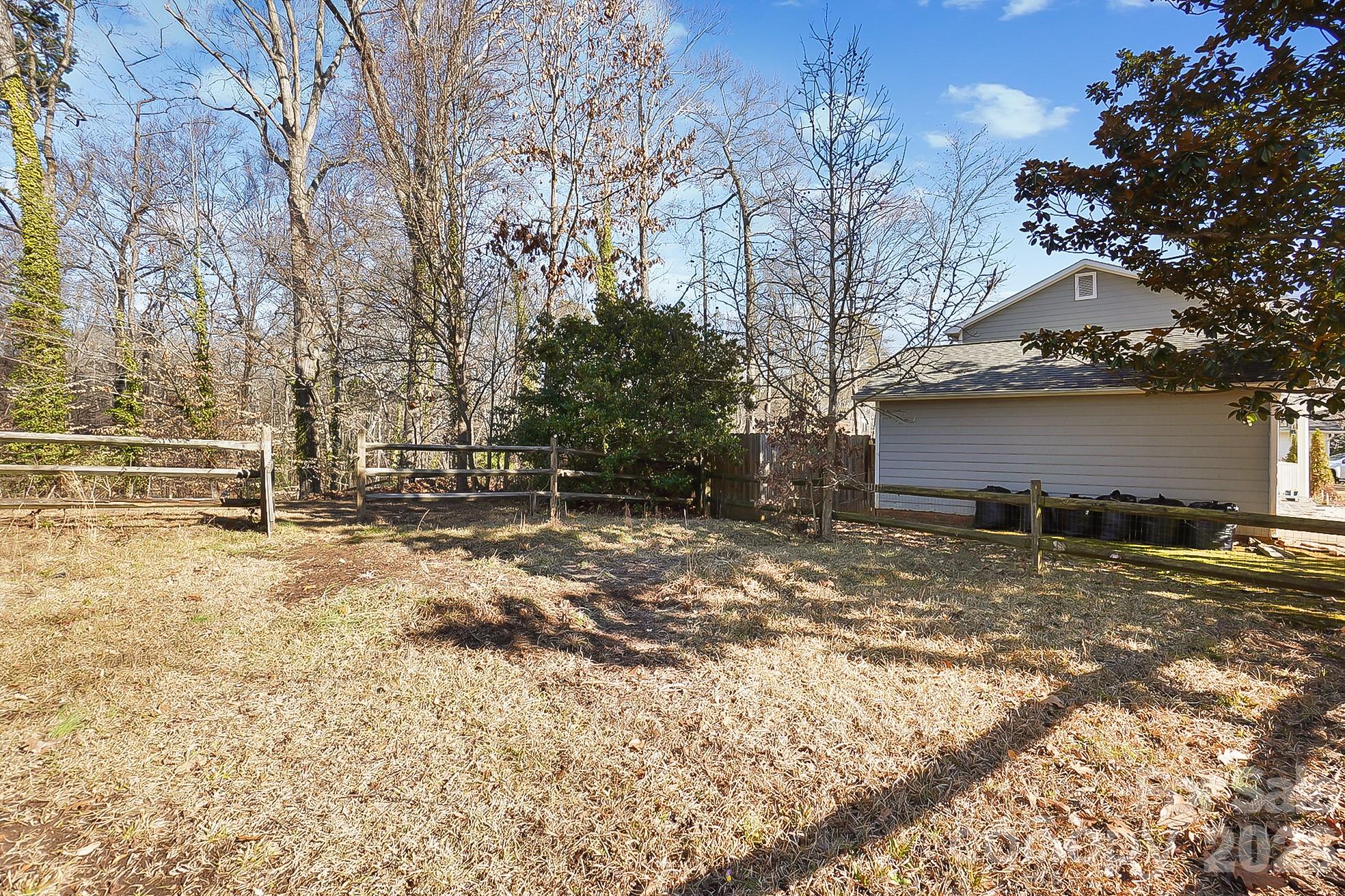 6906 Streamside Drive Charlotte, NC 28212 - Photo 40 of 48 a view of back yard of the house