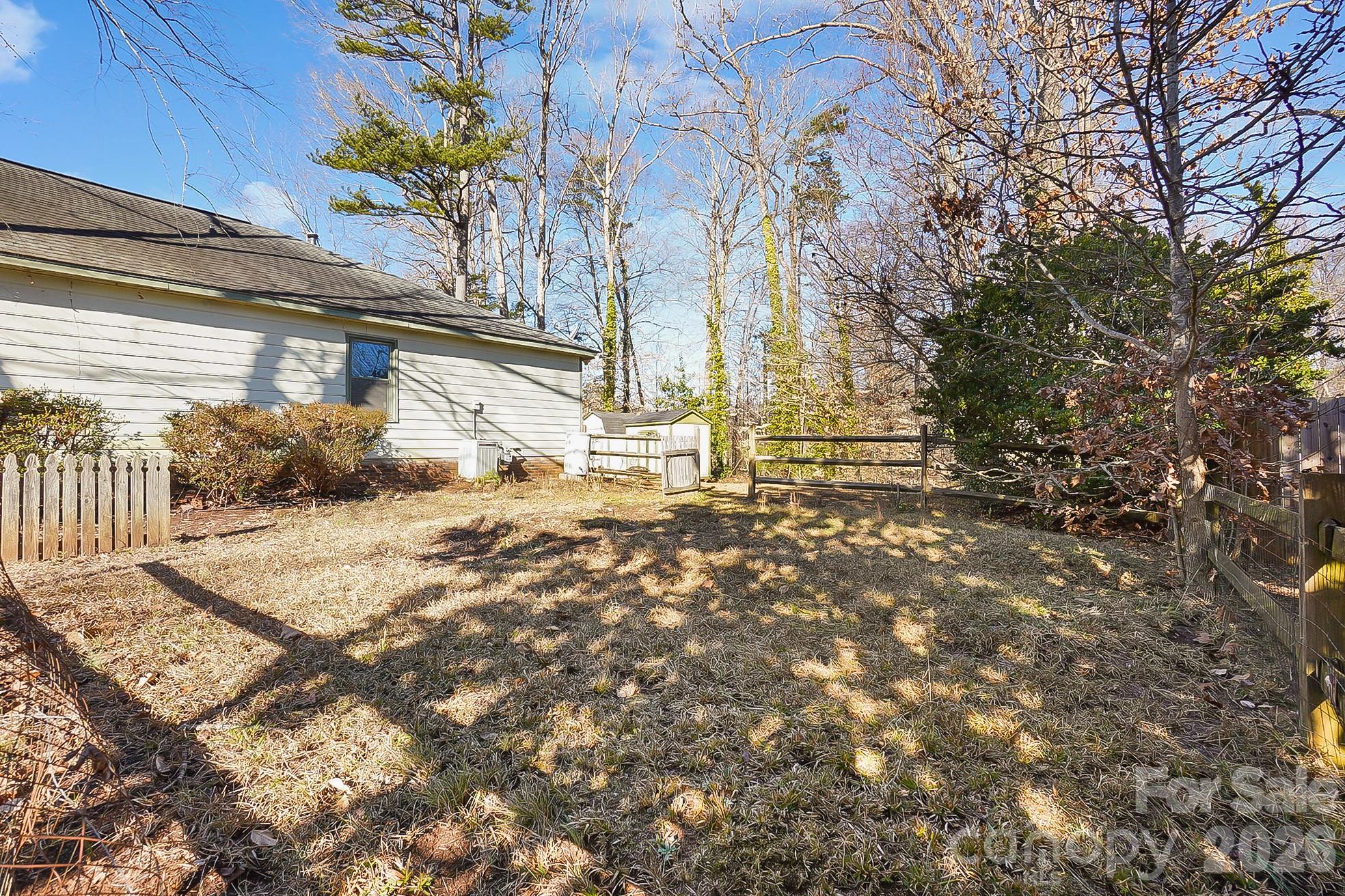 6906 Streamside Drive Charlotte, NC 28212 - Photo 41 of 48 a view of entrance gate of a house