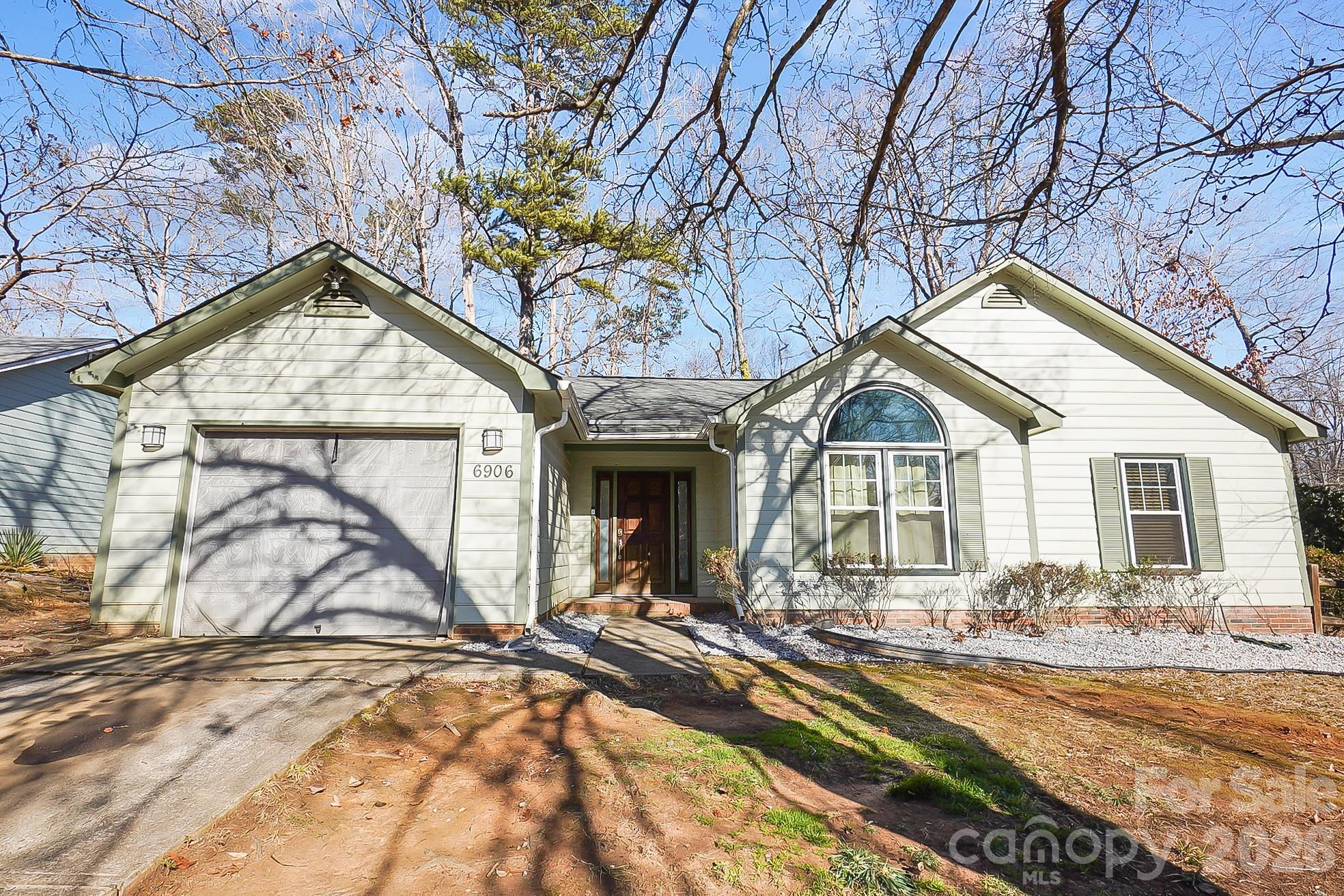 6906 Streamside Drive Charlotte, NC 28212 - Photo 47 of 48 a front view of a house with a yard