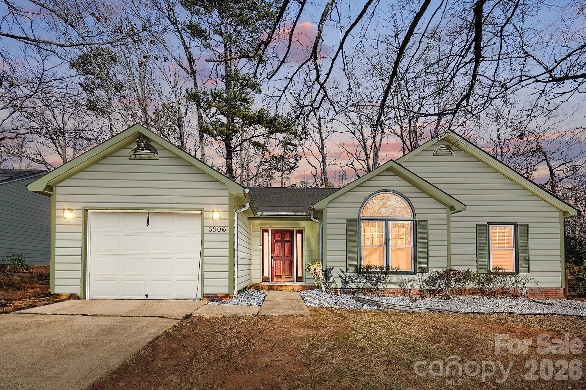 6906 Streamside Drive Charlotte, NC 28212 - Photo 48 of 48 a front view of a house with garden