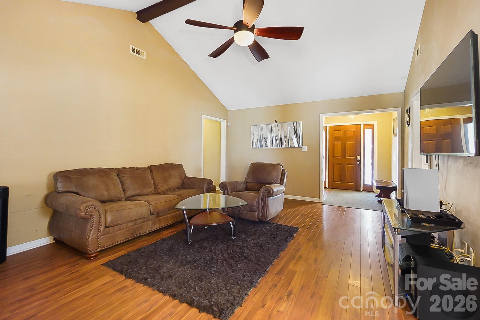 6906 Streamside Drive Charlotte, NC 28212 - Photo 9 of 48 a living room with furniture and a wooden floor