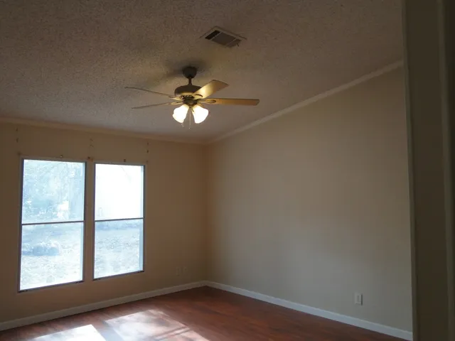 a white bath tub sitting next to a window