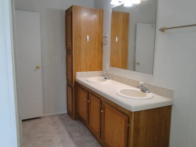 a view of backyard with large trees