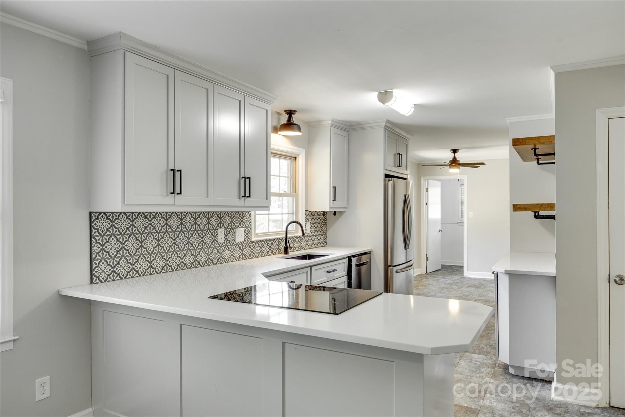 2001 Lakeview Drive Pineville, NC 28134 - Photo 15 of 35 a kitchen with stainless steel appliances a sink a stove and a refrigerator