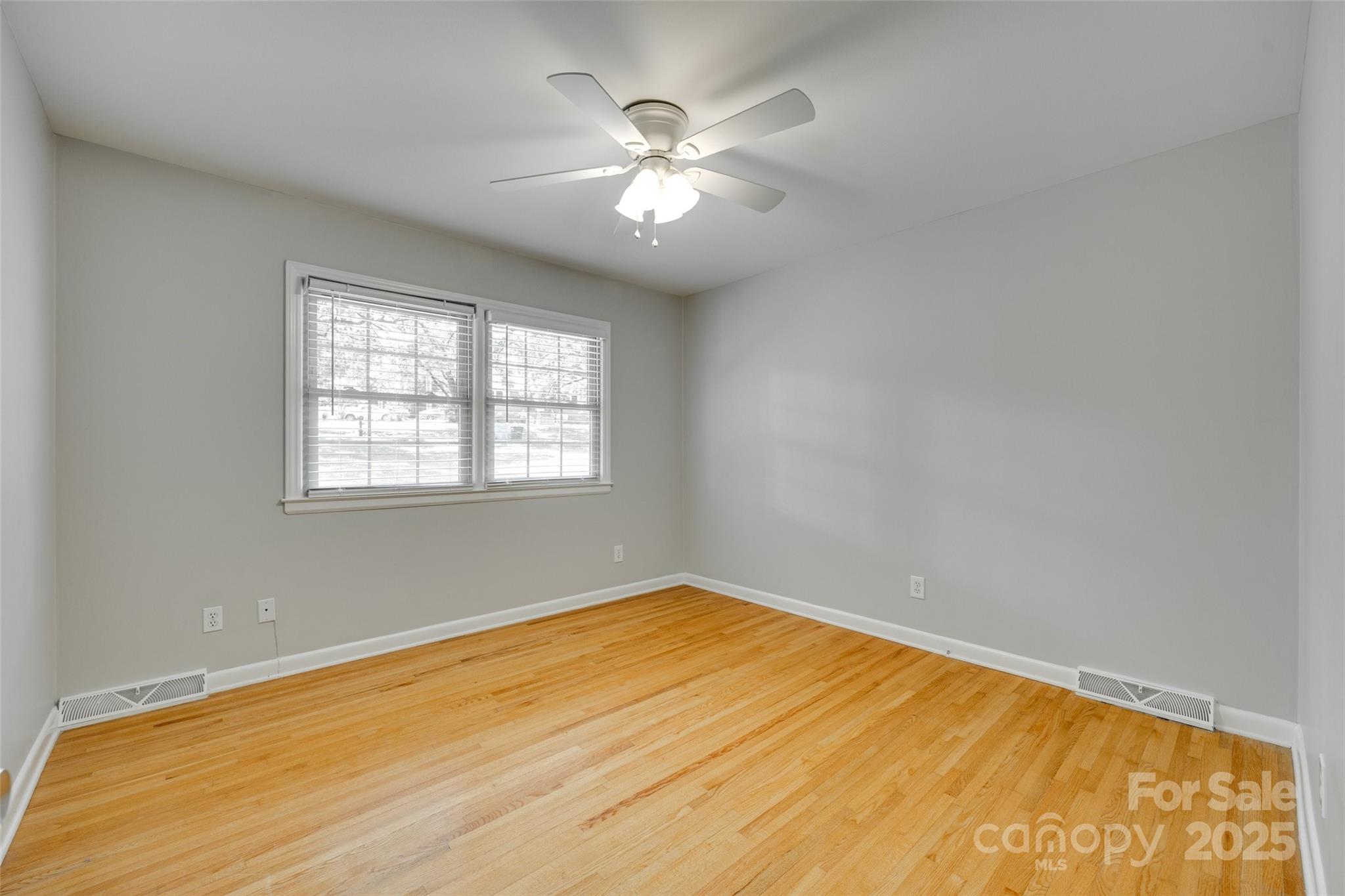 2001 Lakeview Drive Pineville, NC 28134 - Photo 18 of 35 wooden floor in an empty room with a window