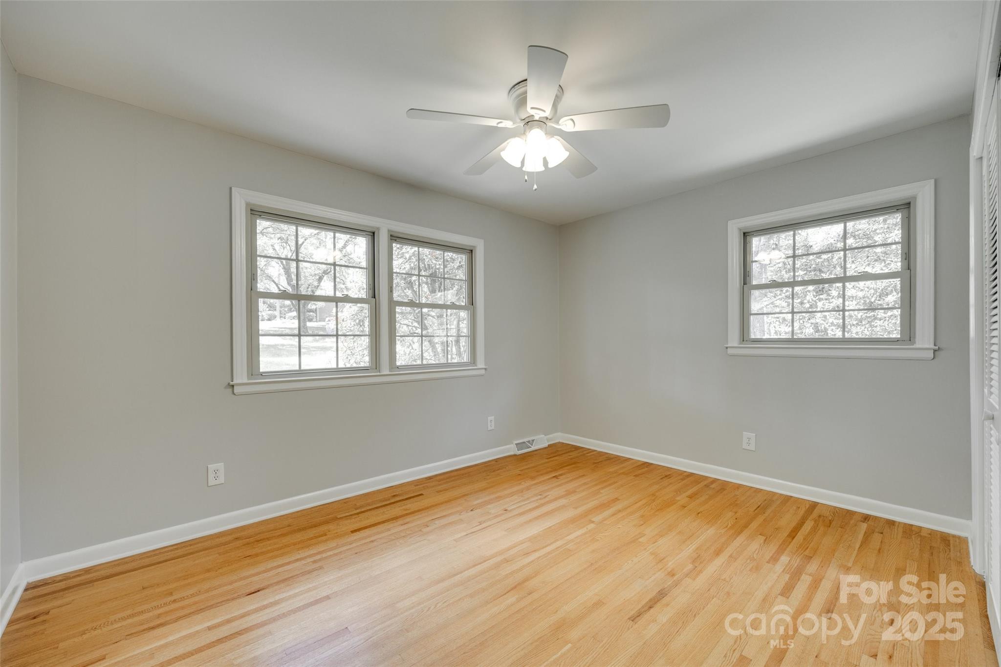 2001 Lakeview Drive Pineville, NC 28134 - Photo 20 of 35 a view of an empty room with wooden floor and a window