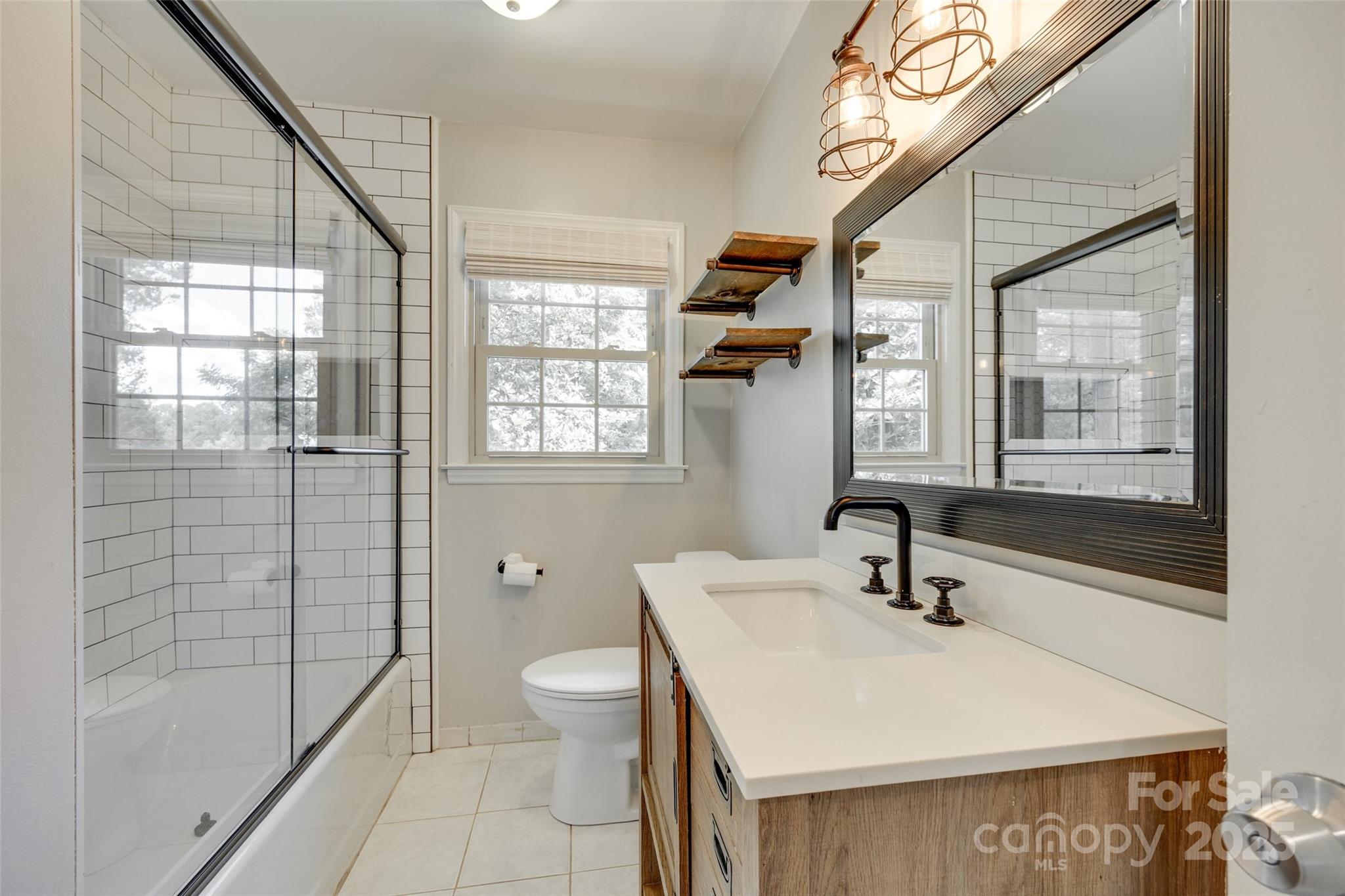 2001 Lakeview Drive Pineville, NC 28134 - Photo 22 of 35 a bathroom with a sink toilet and shower